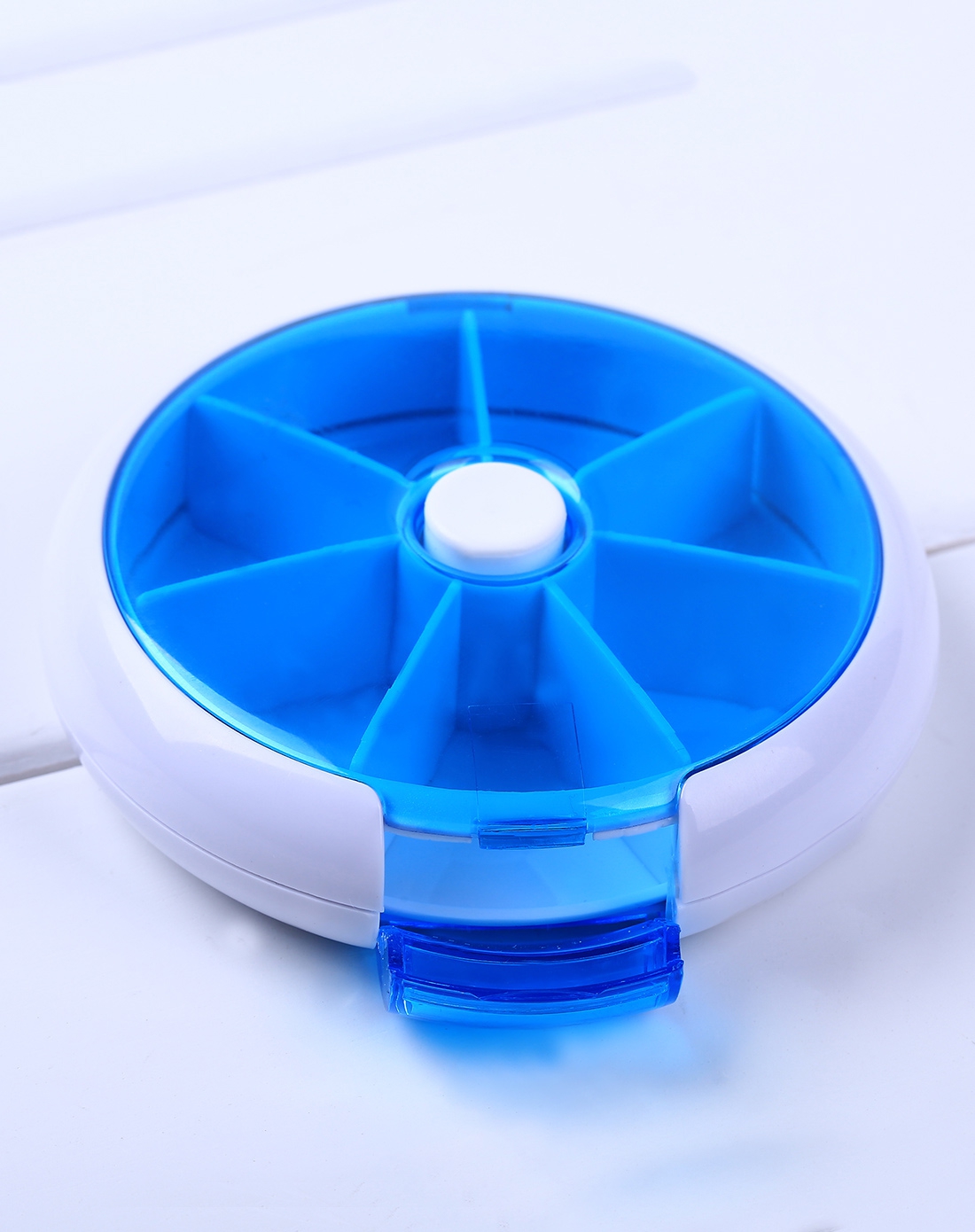 > 蓝色七格自动式圆形药丸收纳盒