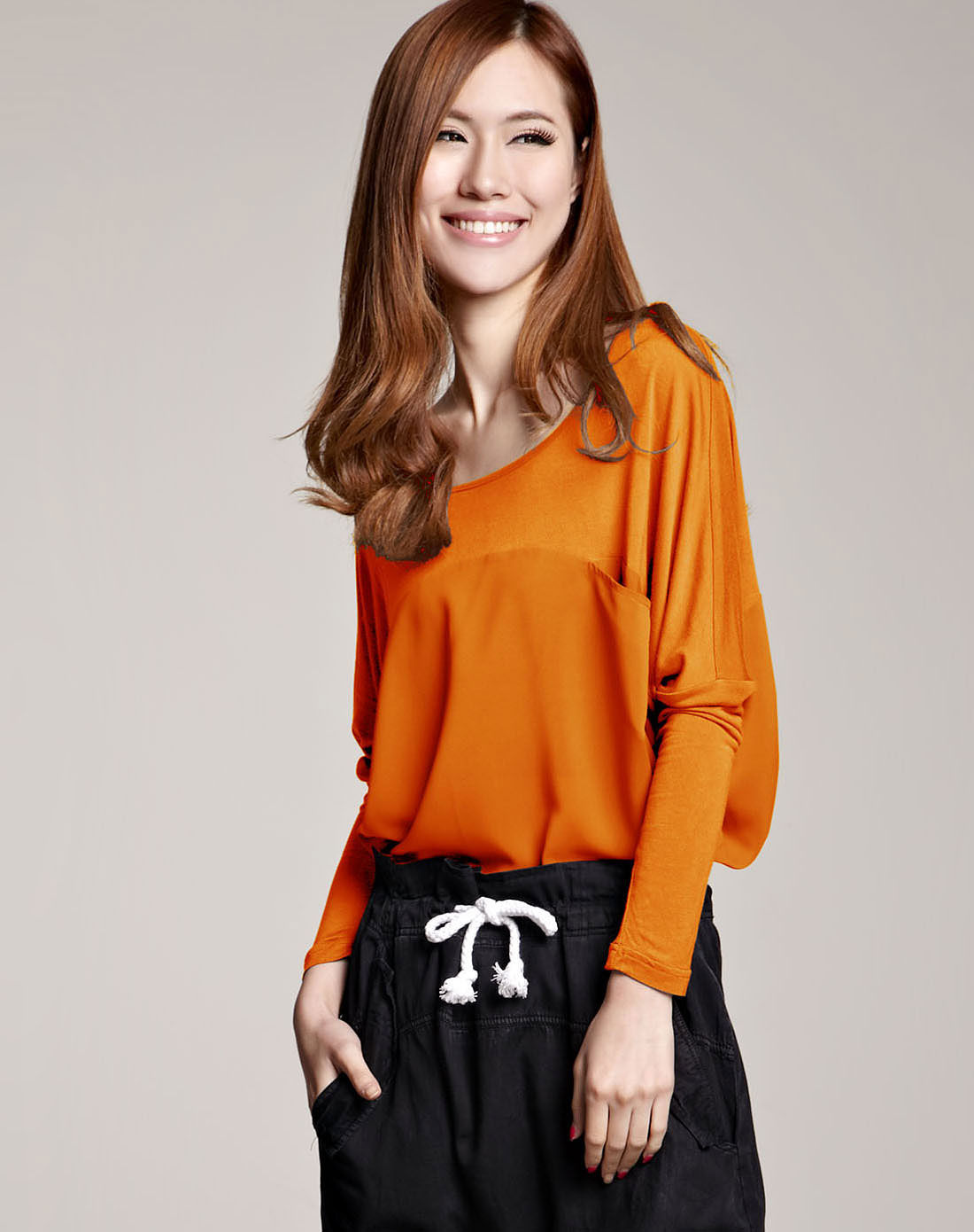 橘色前口袋雪纺拼接宽松上衣 长袖t恤