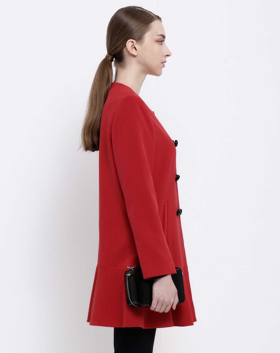 女橙红色小a摆荷叶边风衣